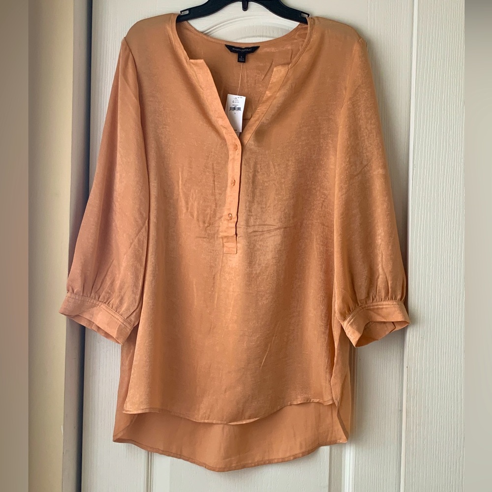 Banana Republic Shiny Tunic Blouse that has never been worn.